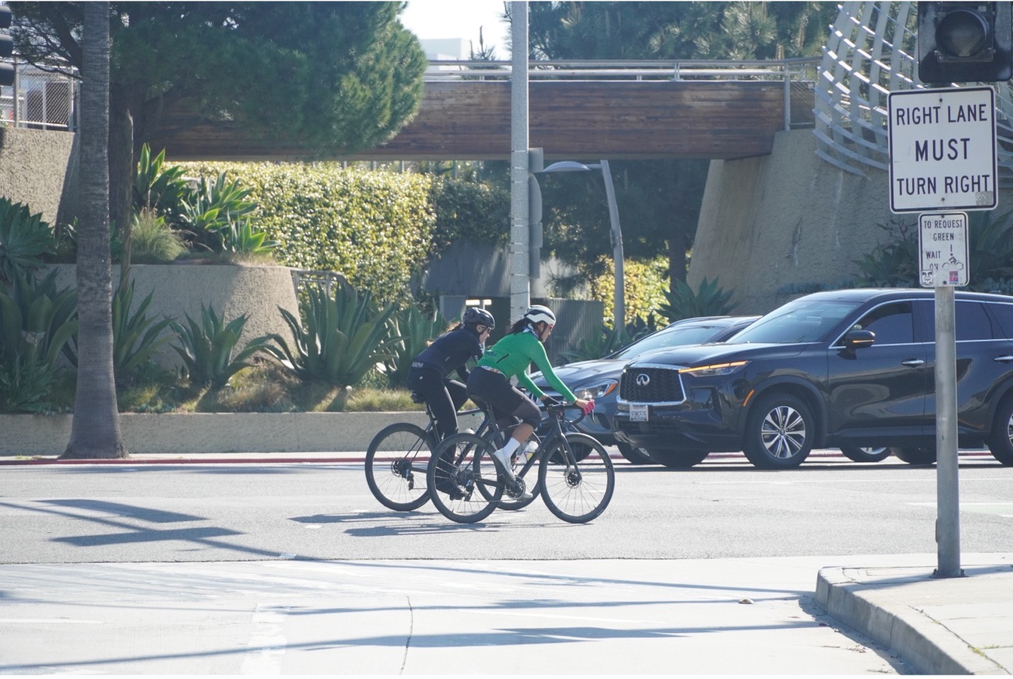 2 people riding bicycles