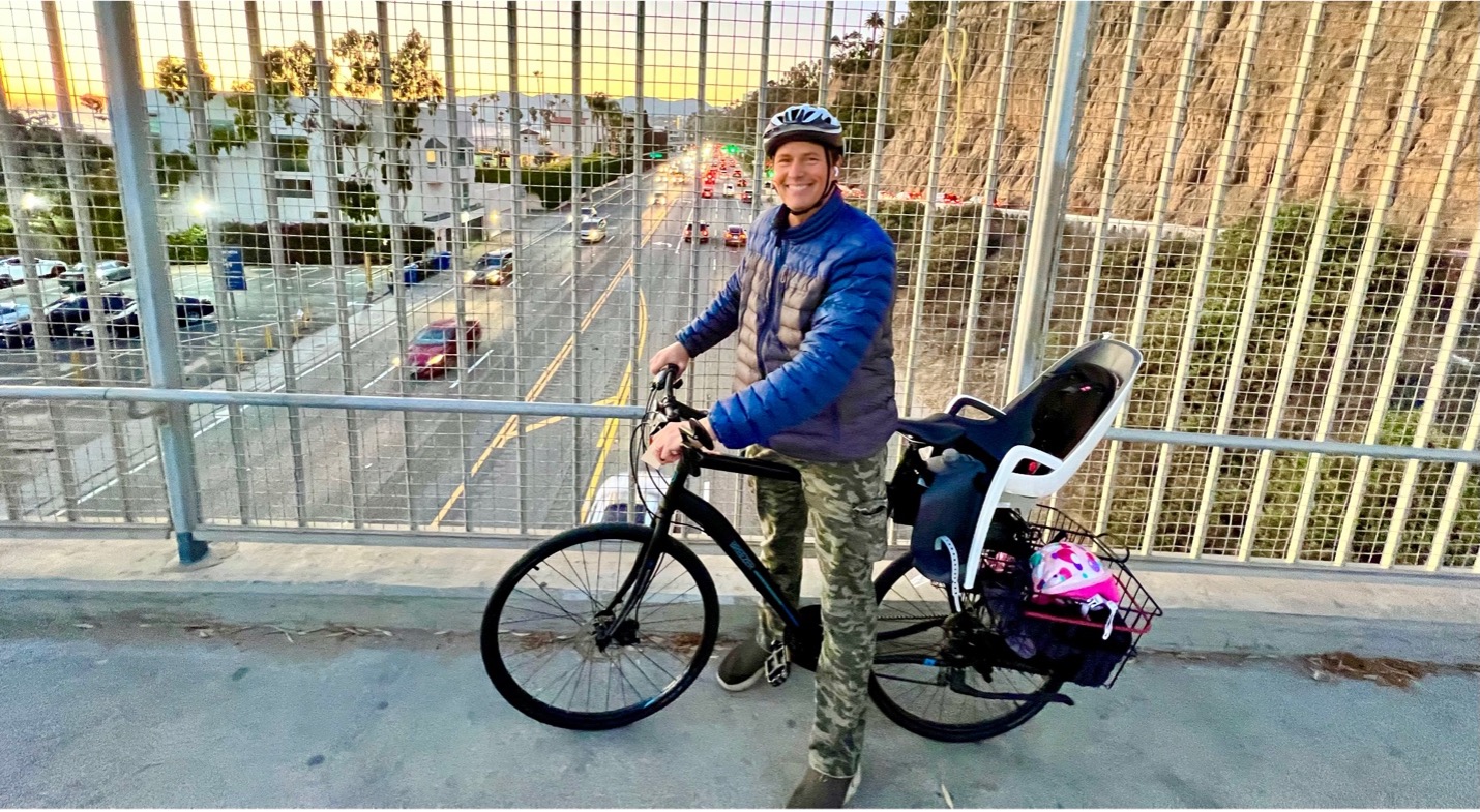 Chris Balish on a bike on an overpass